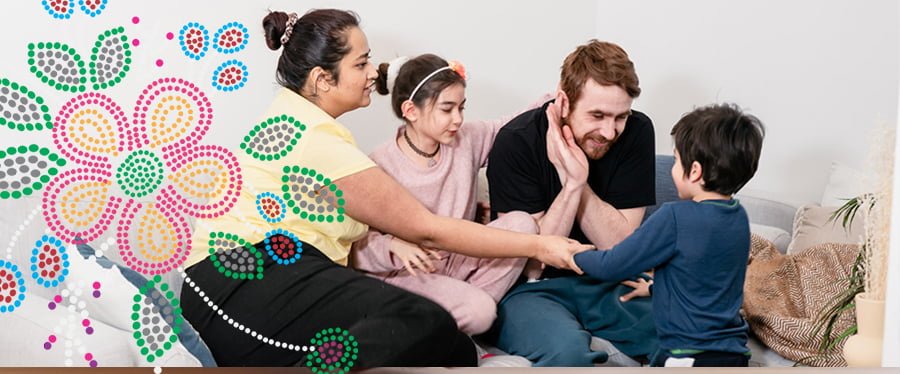 Family members relaxing on a couch together with Metis style beadwork motif overlay